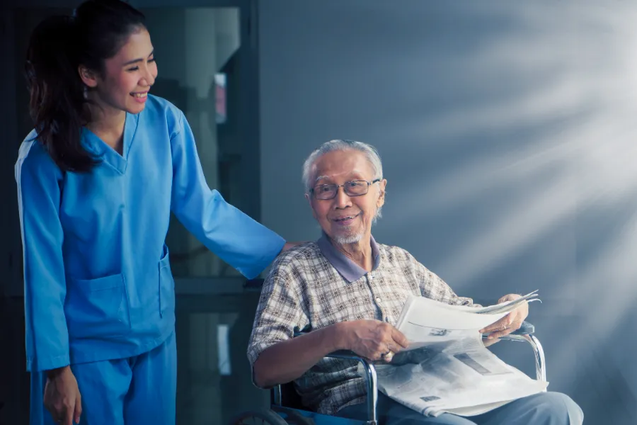happy-old-man-talking-with-his-nurse-hospital